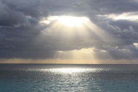 the sun's rays among the dark clouds