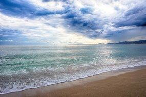 beach near the sea in Mallorca on a cloudy day