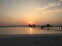 sunset over the bridge in the maldives