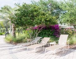 white loungers in the garden at the hotel