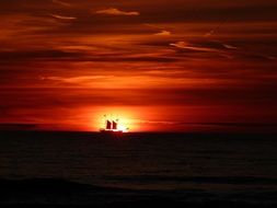 sailing ship in the glow of sunset