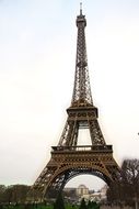 Eiffel Tower on a background of gray sky in Paris