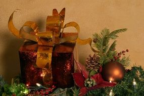Christmas decorations next to a gift box