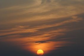 bright sun in the dark evening sky