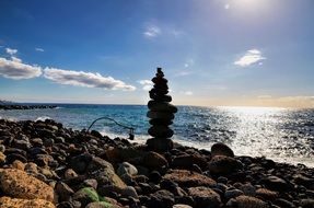 balance of stones on a stone beach