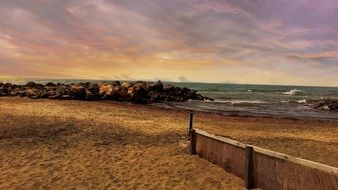 fence on a sandy beach