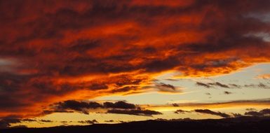 red sky in clouds at sunset