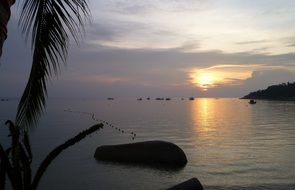 sunset over tao island in thailand