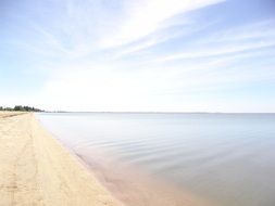 white sand coast near the calm sea