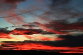 crimson sunset in the clouds on the horizon