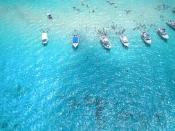 tourist yachts in the blue lagoon of the Caribbean