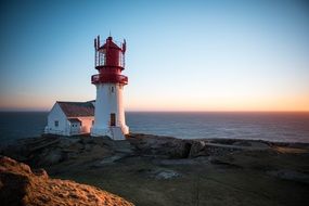 small lighthouse on the coast of norway