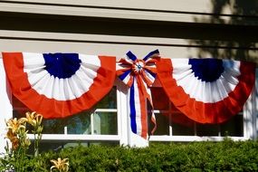 colorful banners on the windows for Independence Day in America