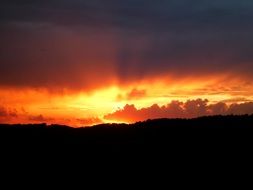 blazing sun on the horizon at sunset