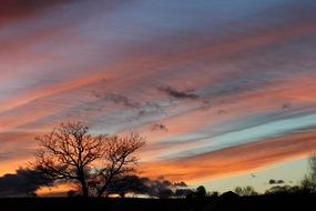 orange stripes of clouds in the night sky