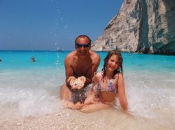 dad with daughter on Navaghio beach, Greece