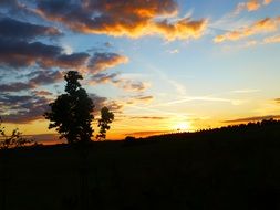 silhouettes of clouds in the bright evening sky