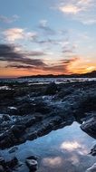 orange sunset over the stone coast of spain
