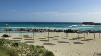 beach umbrellas on the beach near the sea