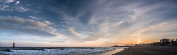 wide beach at sunset on the coast of Spain