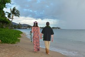 Romantic couple walking on a beach