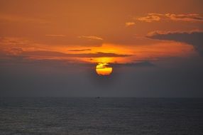 Dawn Sky in the clouds above the water
