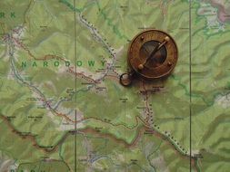 retro compass on the map