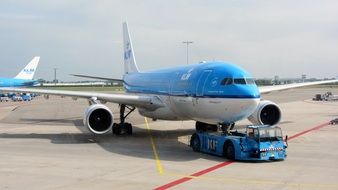 White and blue plane in the airport