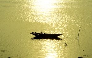 fisher boat at sunset