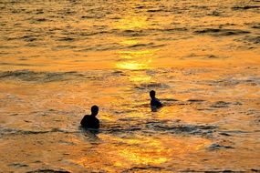 bathers at sunset