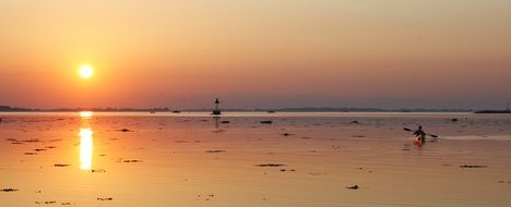 kayaker at sunset in denmark