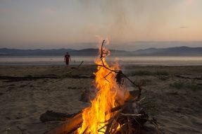 bonfire on the beach at dusk