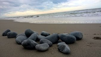 smooth stones on the beach at dusk