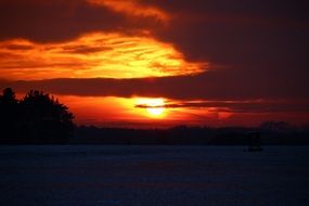 red Sunset over snowy countryside