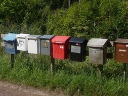 variety of mailboxes along the road