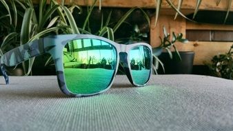 green sunglasses on the table