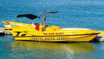 yellow Speed Boat with signs in the beautiful water near Cyprus