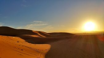 sunset in a peaceful desert in africa