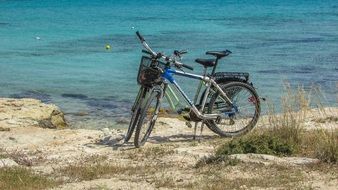 bikes stand on the beach