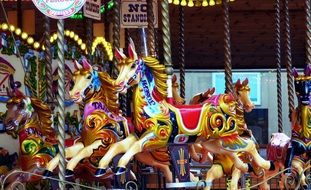 carousel with retro wooden horses