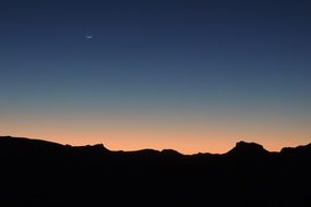 black silhouettes on the horizon at sunset