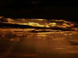 golden sunset and black clouds