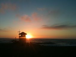 lifeguard station on the coast during sunset