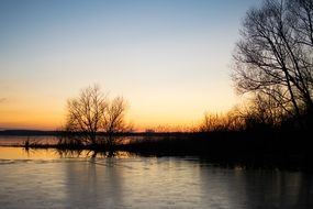 sunset over a frozen lake