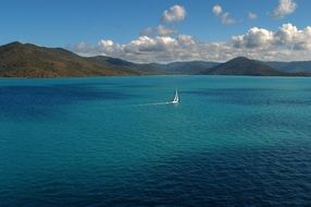 photo of a sailing boat in the ocean near the Great Barrier Reef