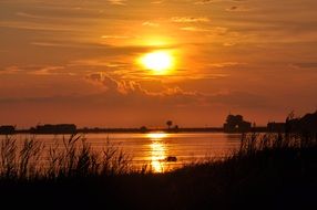 yellow evening sun reflected in water