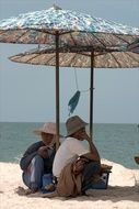 Parasol on a sand beach