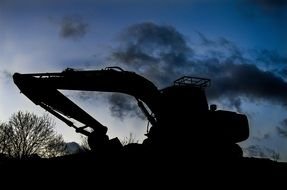 Digger Silhouette at Sunset