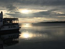 Picture of the boat on a water at the sunset