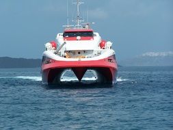 red and white Supercat Boot on sea at coast, greece, Santorini